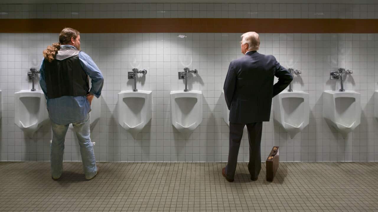 Two men at urinals