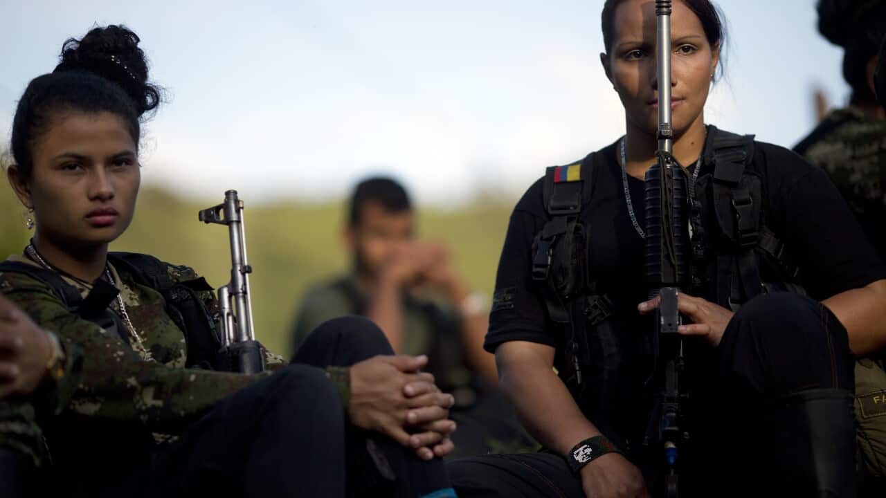 File photo: Juliana, 20, left, and Mariana, 24, rebel soldiers for the 36th Front of the Revolutionary Armed Forces of Colombia, or FARC