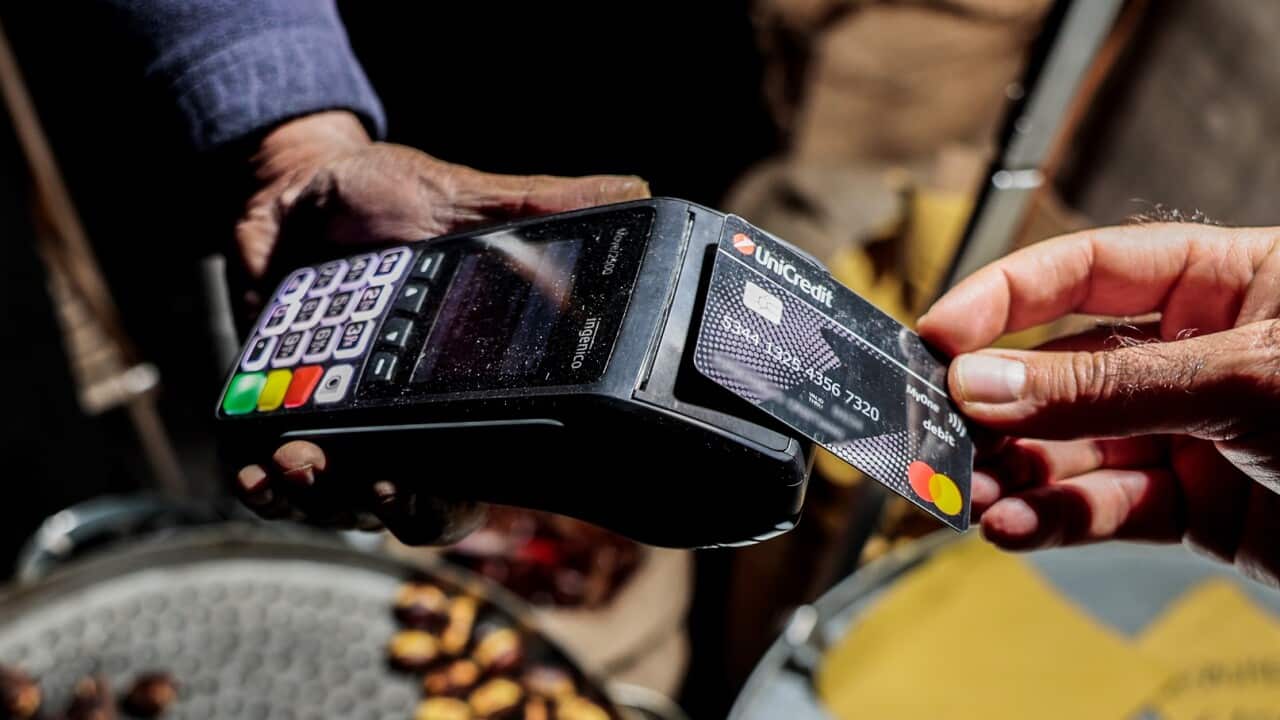 A consumer making a purchase with a credit card