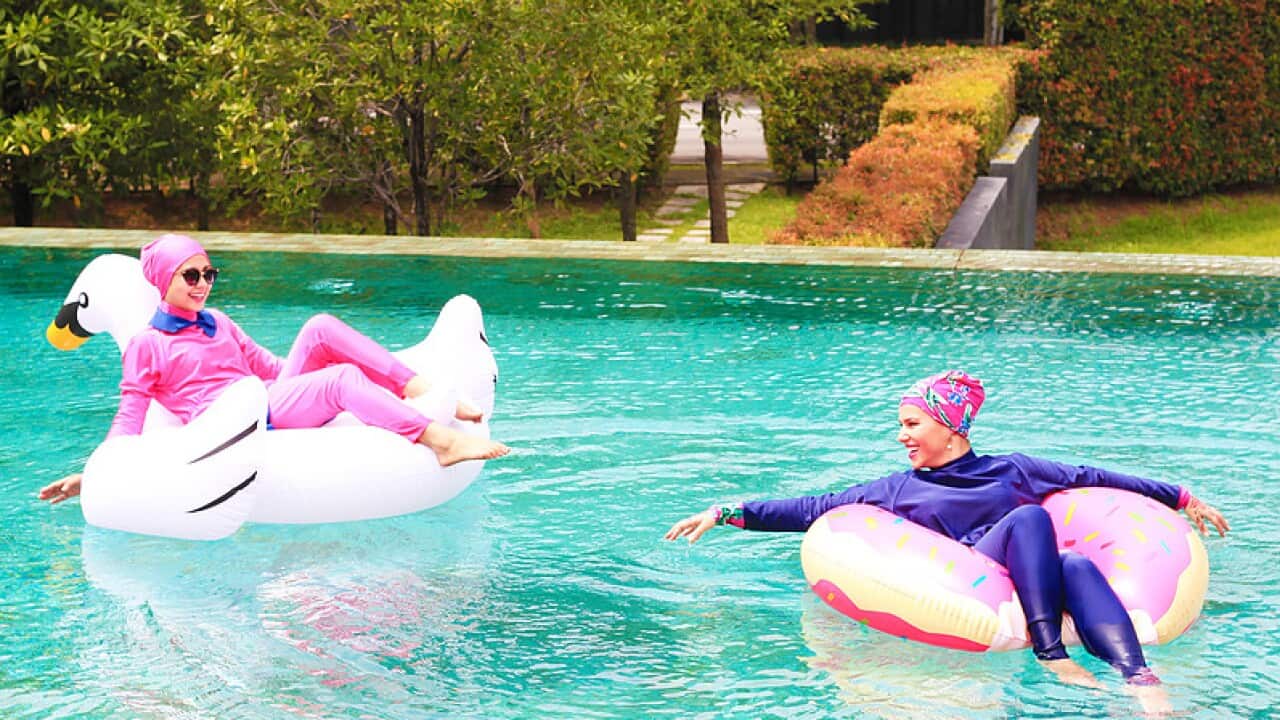 Women swimming in burqinis