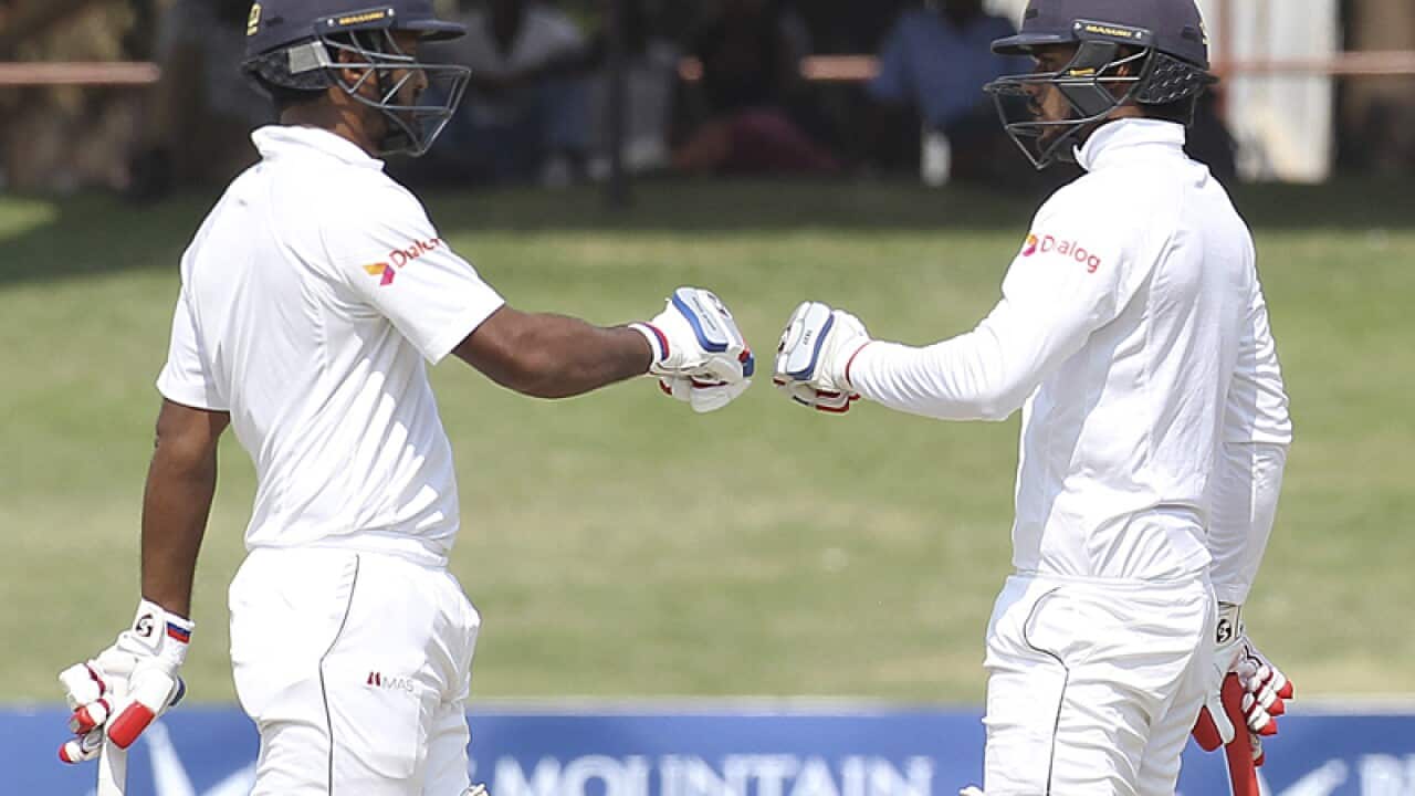 Sri Lanka batsmen Dimuth Karunaratne, right, and Dhananjaya de silva