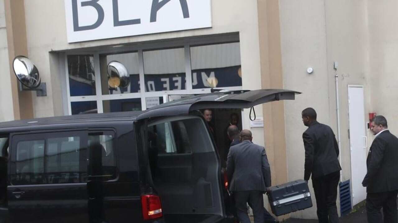 Cases containing the flight recorders are carried into the BEA office