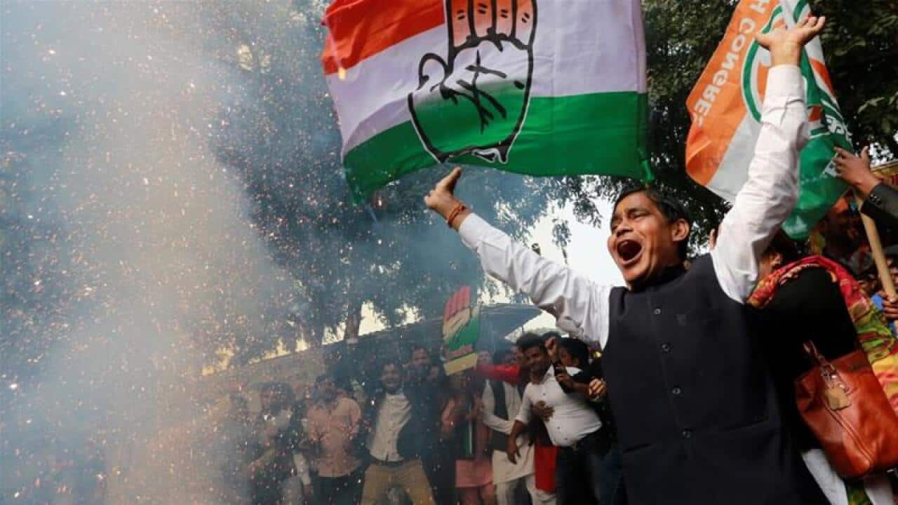 Supporters of the Congress party celebrate election results
