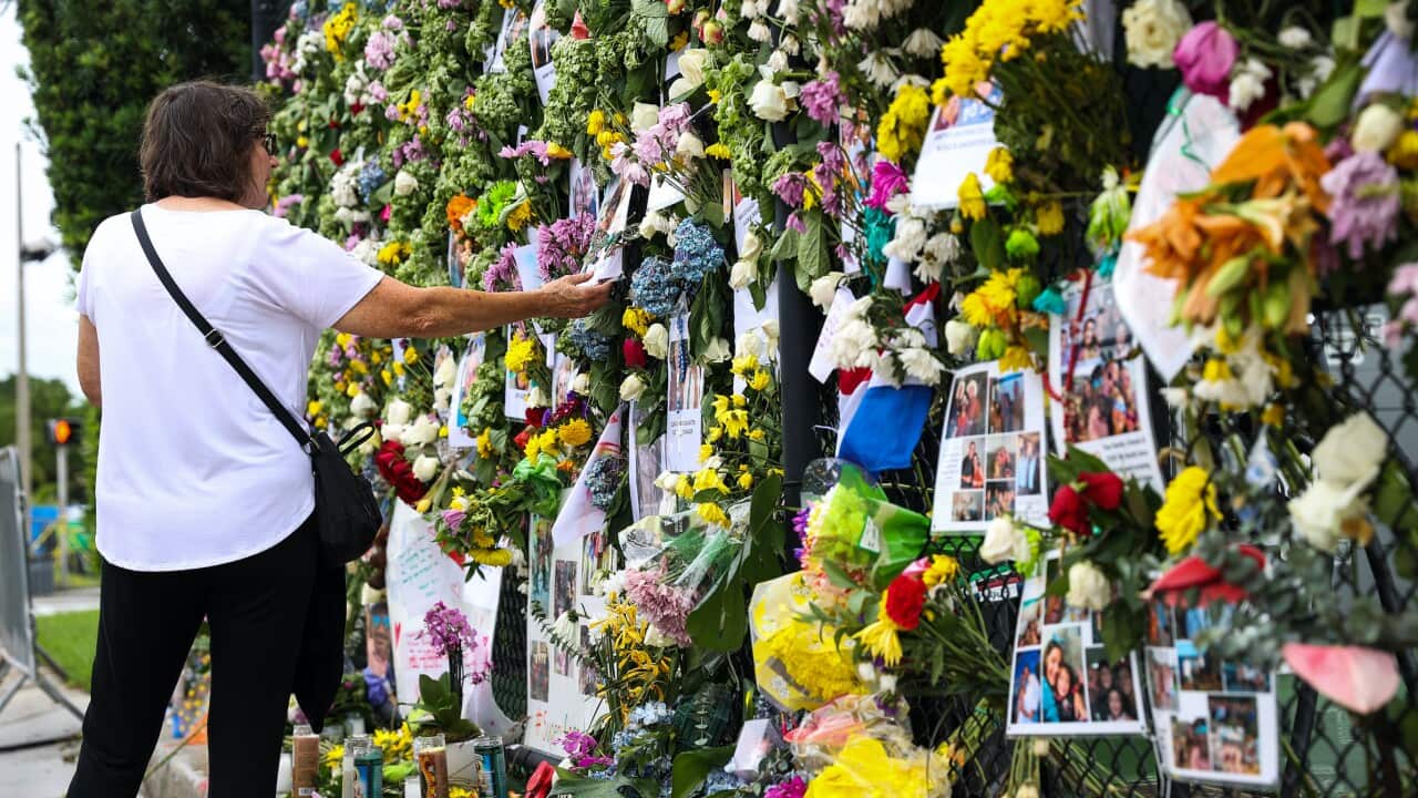 Family members hold vigil for the missing victims of a condo collapse in Surfside, Florida, on June 30, 2021.