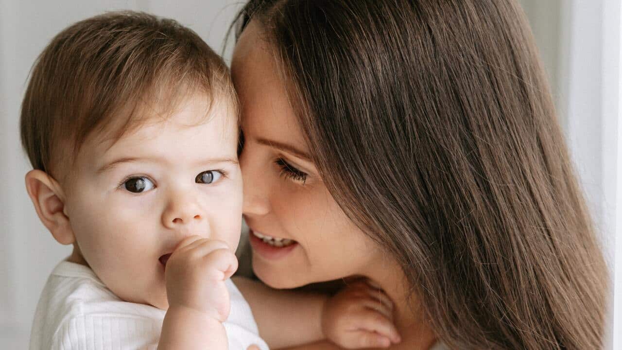 Mother holding her child