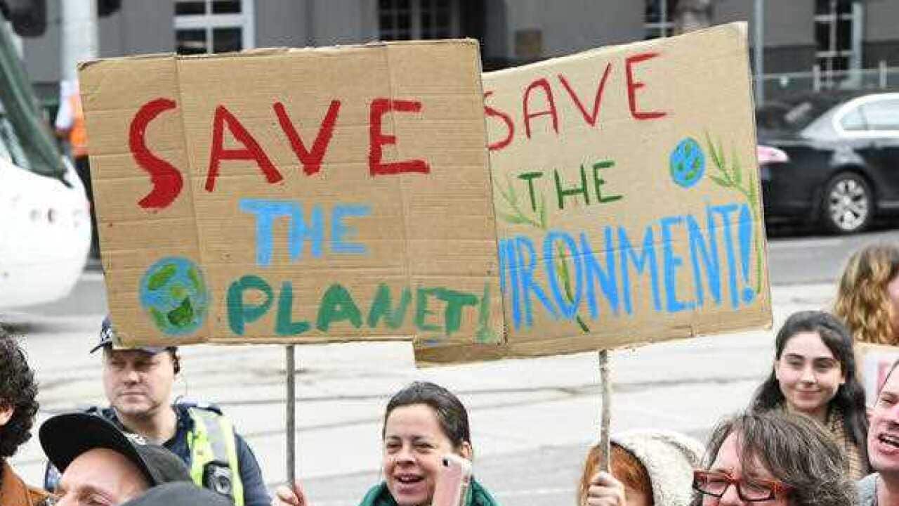 Climate change protesters are seen outside of the Victorian State Parliament, Melbourne, Saturday, June 1, 2019