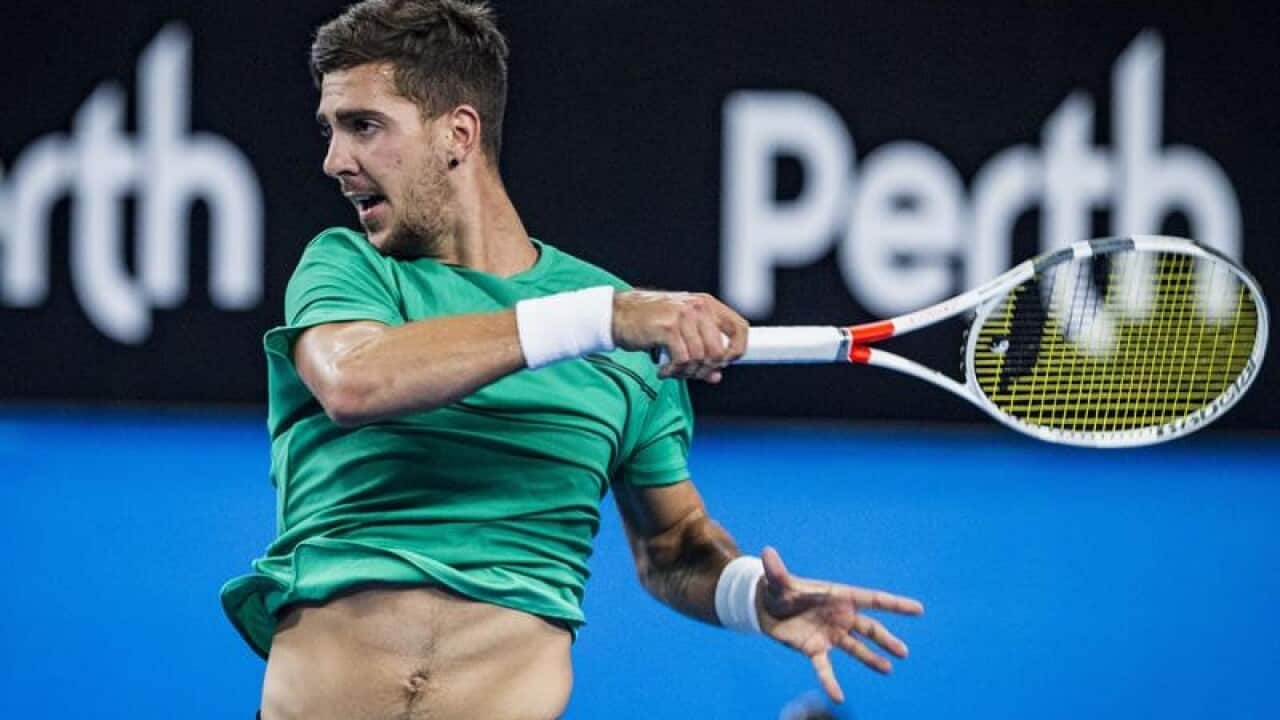 Thanasi Kokkinakis in action at the Hopman Cup