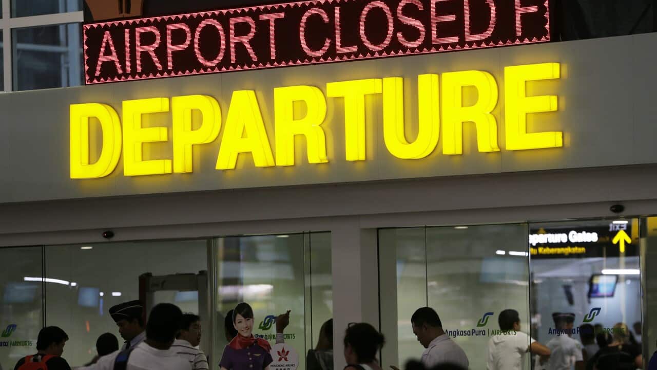 Passengers wait for their delayed flights at Bali's Ngurah Rai International Airport in Bali, Indonesia (EPA/MADE NAGI)