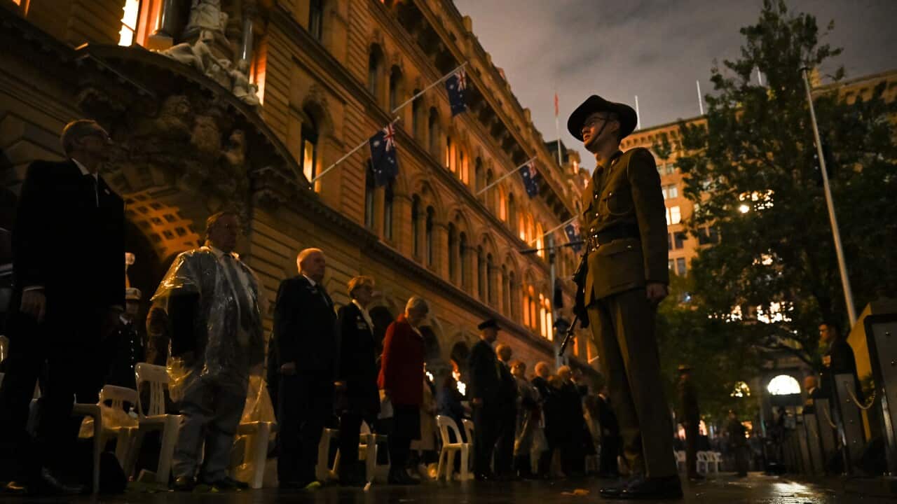 A crowd standing outside.