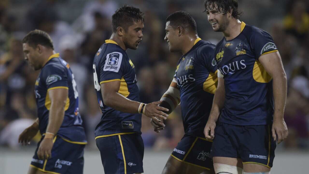 Sam Carter of the Brumbies (R) celebrates after scoring a try