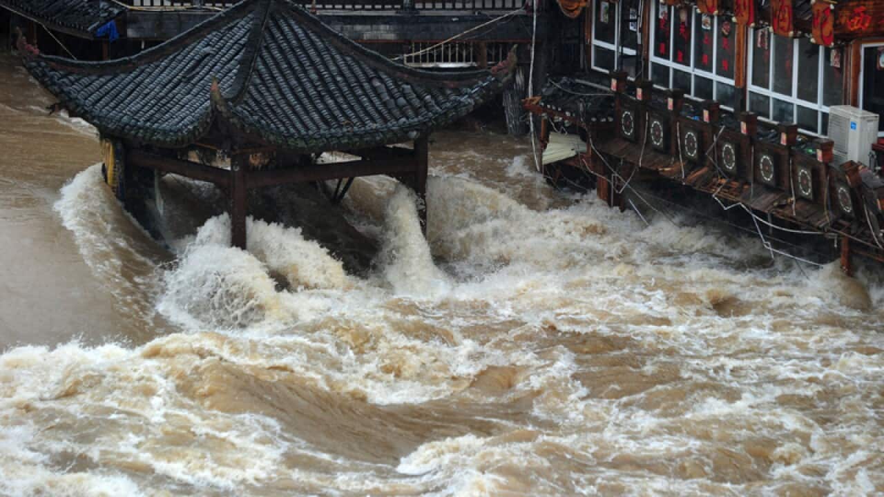 Houses half-submerged by floods caused by rainstorms at Fenghuang.