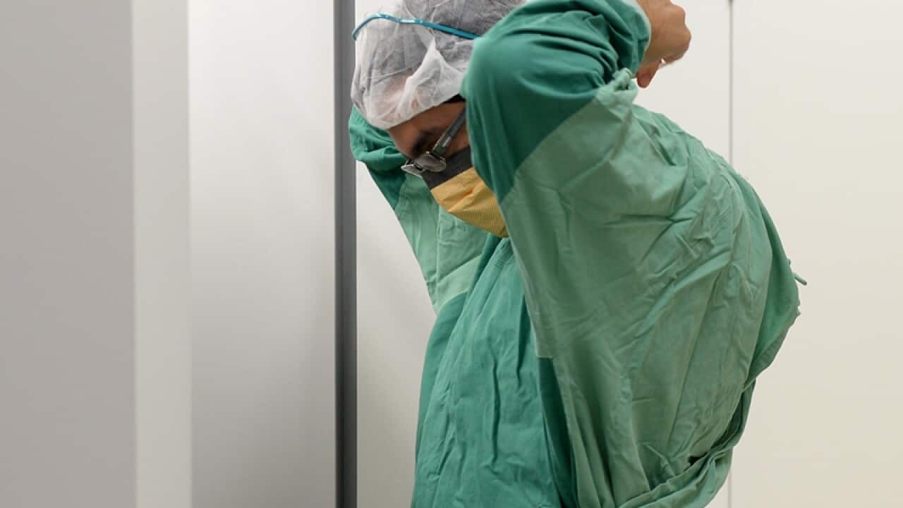 A surgeon prepares for theatre