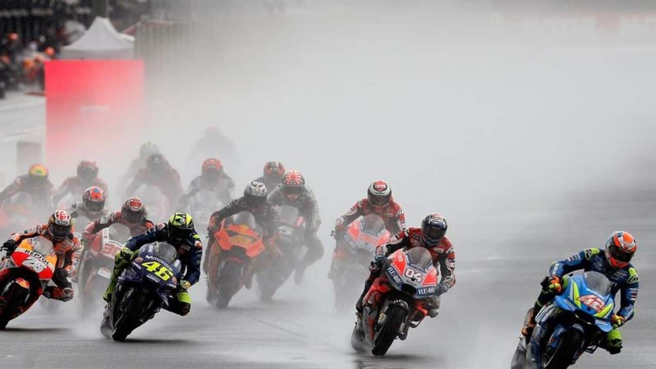 The racers on the very wet track