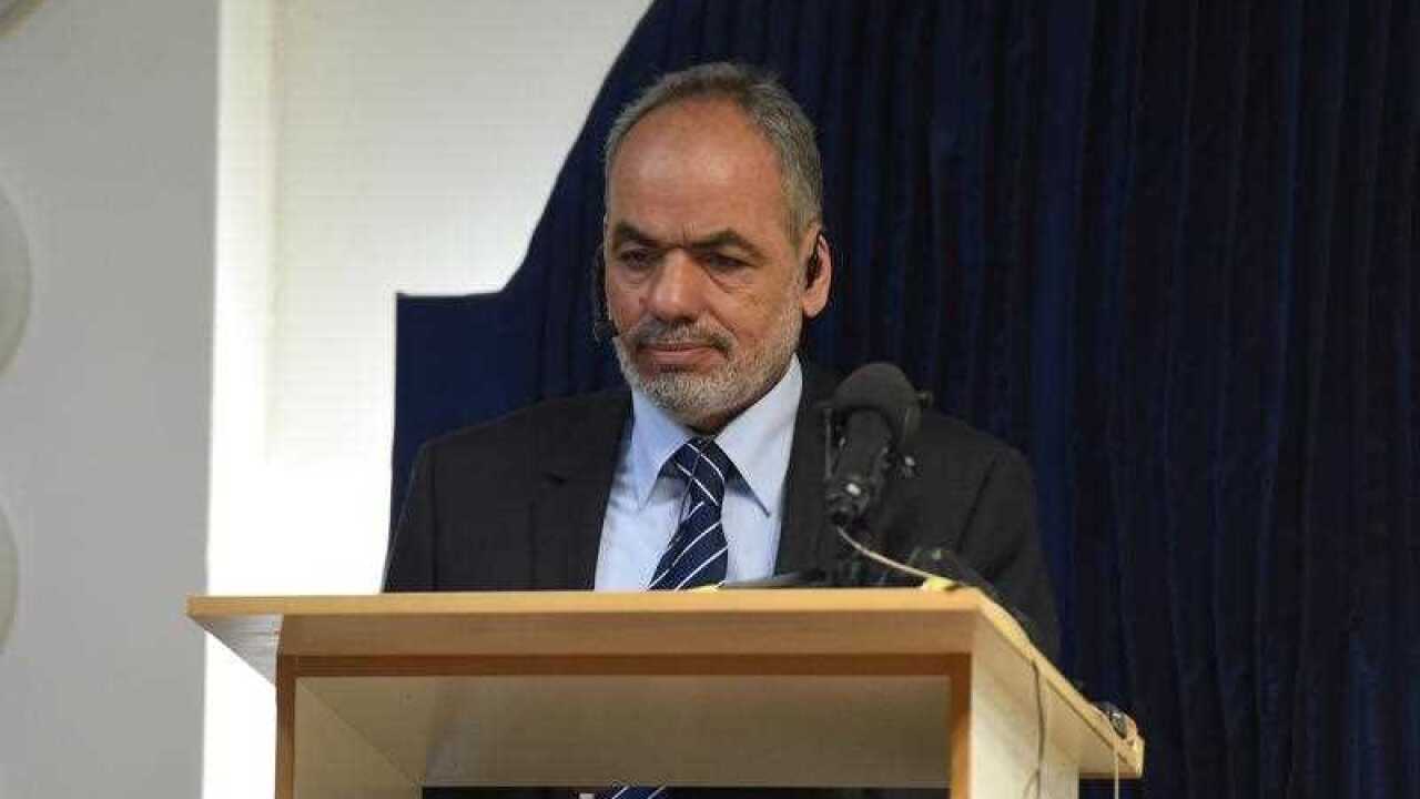 Parramatta Mosque chairman Neil El-Kadomi speaks to worshippers at Parramatta Mosque during a Friday prayer meeting.