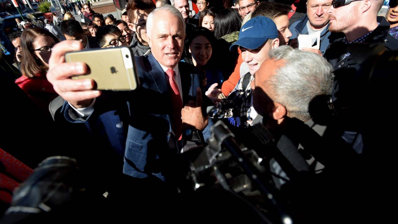 Australian Prime Minister Malcolm Turnbull speaks to locals during a street walk in Hurstville in Sydney, Wednesday, June 29, 2016.