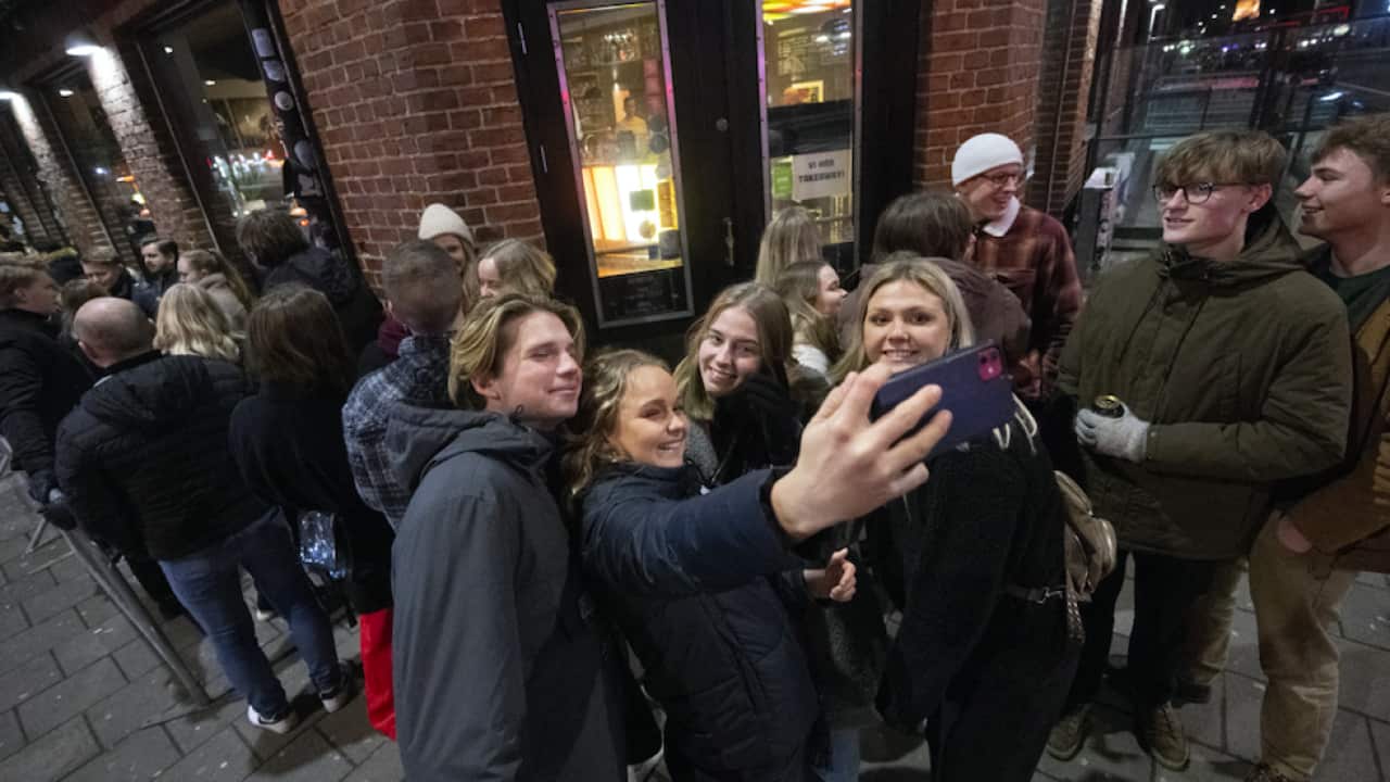 People queue outside a nightclub in Malmo, Sweden, 9 February 2022.