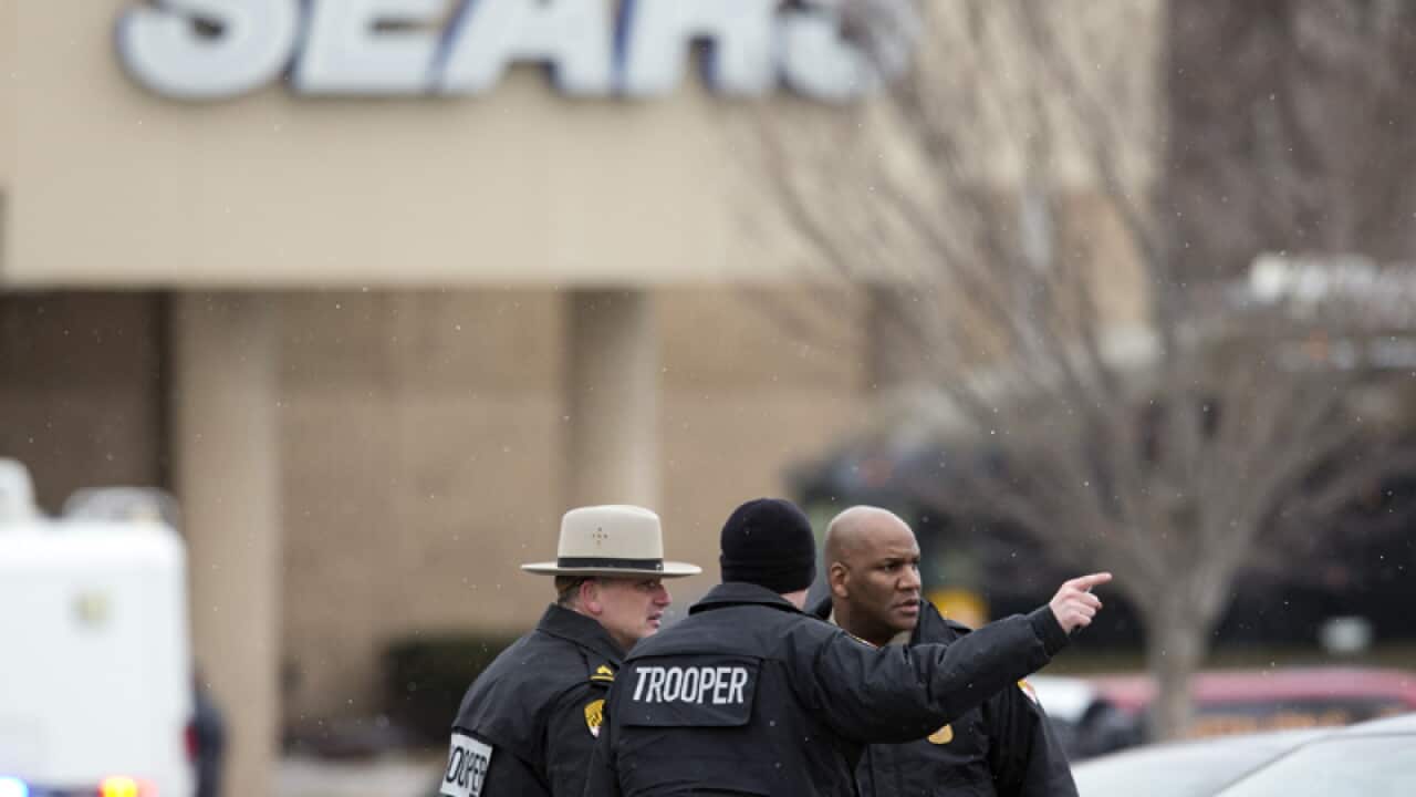 Police outside a Sears store after a shooting at The Mall in Columbia