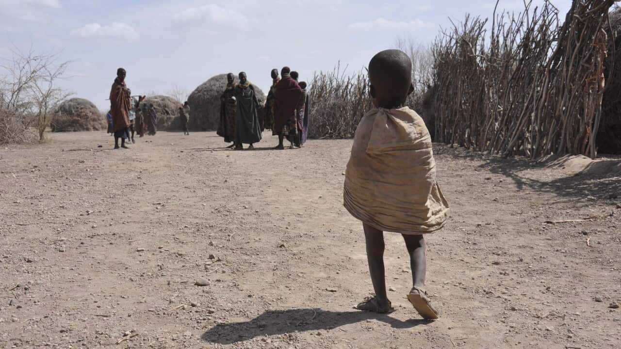 A little Turkana girl walks towards an Oxfam distribution center to receive food in central Turkana district, Kenya