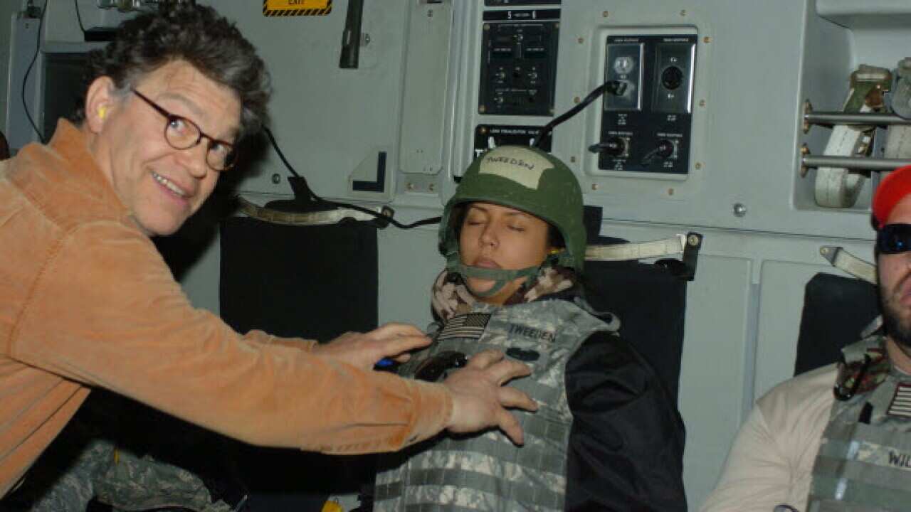 Senator Franken said the photo "was clearly intended to be funny but wasn't".