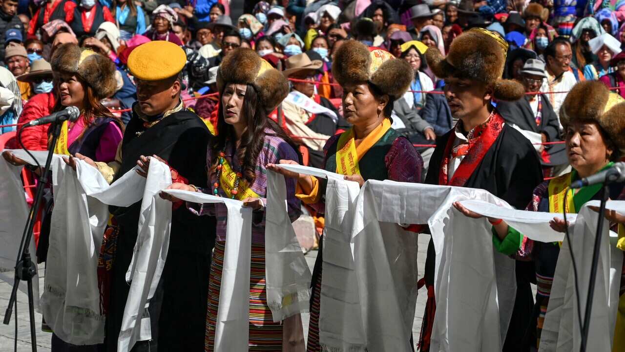 Buddhist devotees perform a ritual during the celebrations to mark the third day of the 'Lhosar', a start of the new year for Buddist, Sherpa, Tamang and Tibetan, in Kathmandu on February 12, 2024.