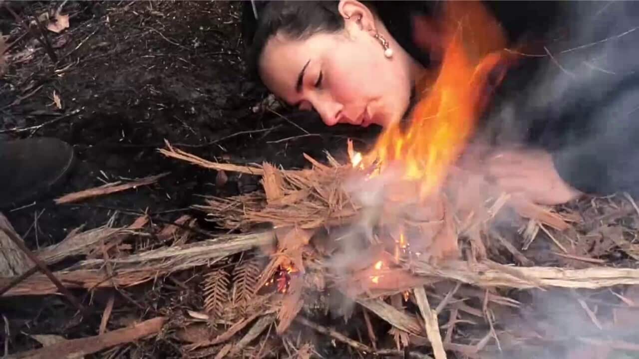 Meg Lockley taking part in the cultural burn (SBS).jpg