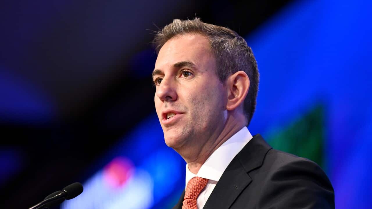 Man stands in front of a lectern