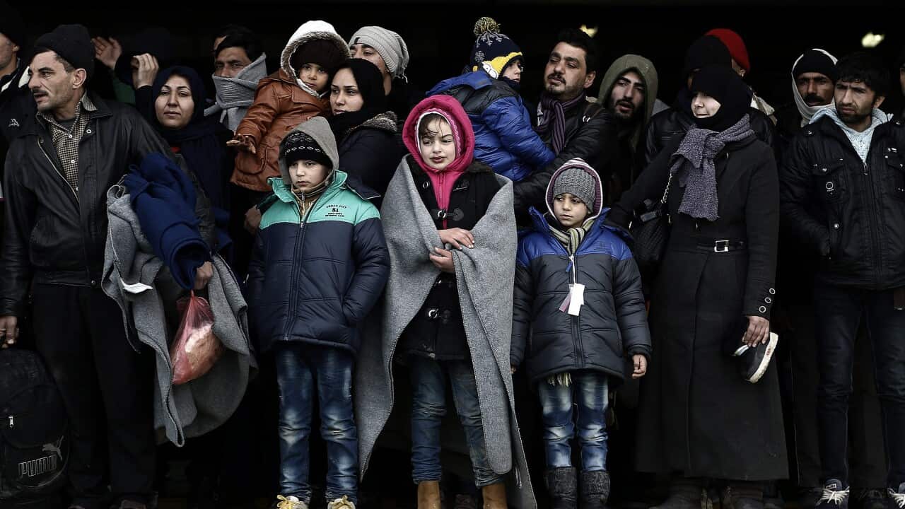 Refugees and migrants wait to disembark the ferry 'Eletherios Venizelos' at the port of Piraeus, near Athens, Greece, 23 January 2016