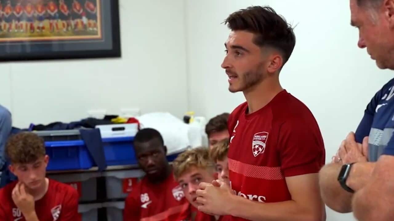 Josh Cavallo standing in a room