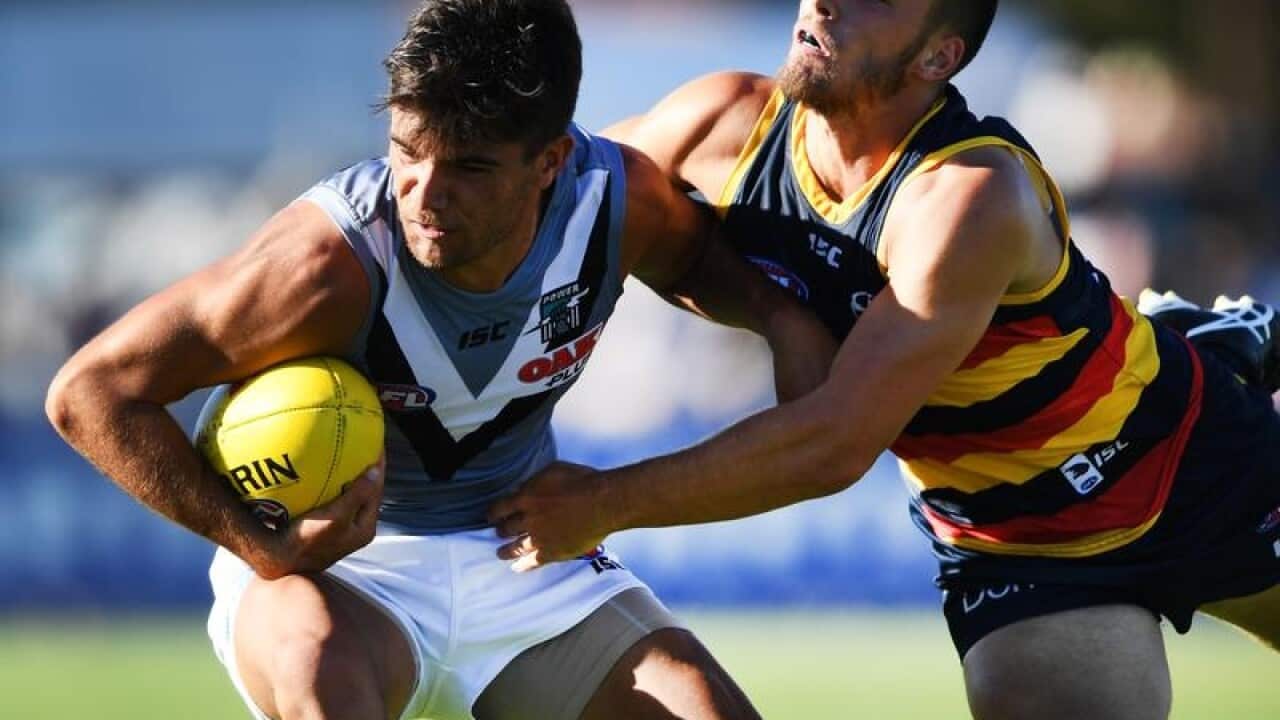 A file image of Riley Bonner of the Power in action against the Crows.