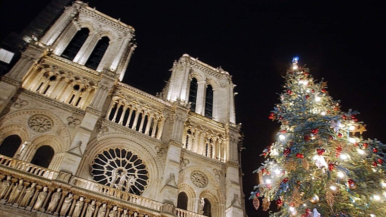 View of the Notre-Dame cathedral in Paris during the inauguration of its Christmas illuminations, Monday, Dec. 23, 2002. (AP Photo/Jacques Brinon)