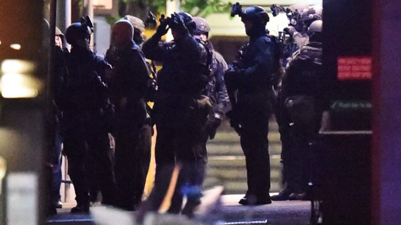 Police storm a cafe in Sydney's Martin Place