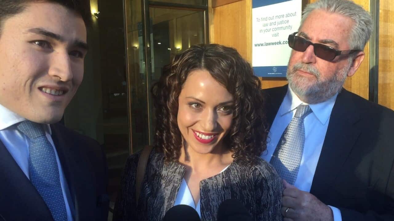 Claire Helen, whose videotaped arrest went viral, leaves Downing Centre Local Court in Sydney on Friday, May 13, 2016 after being cleared of assaulting NSW police officer. (AAP Image/Rebekah Ison) NO ARCHIVING