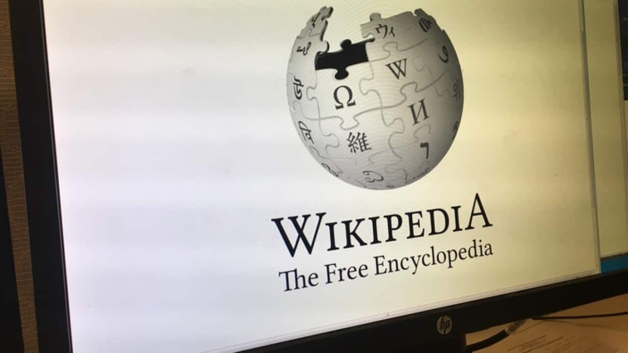 The Wikipedia logo on a computer screen