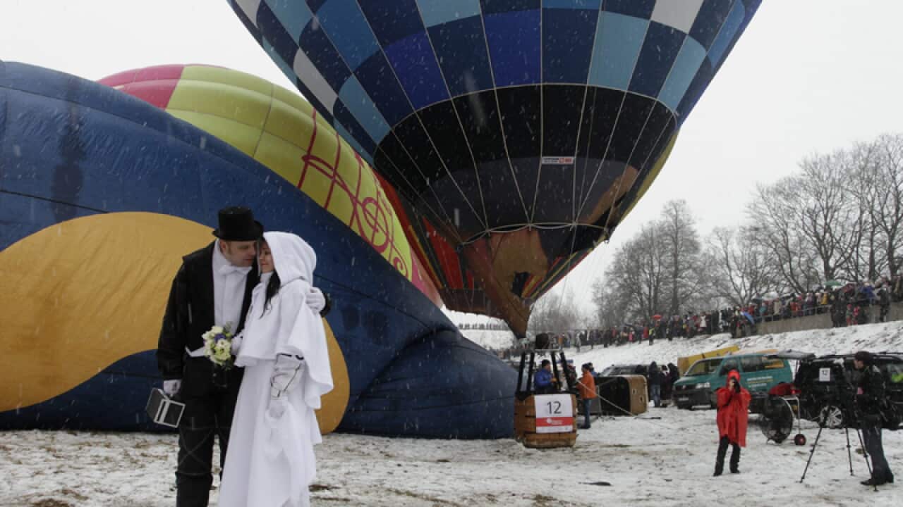 A couple participate in an airborne wedding