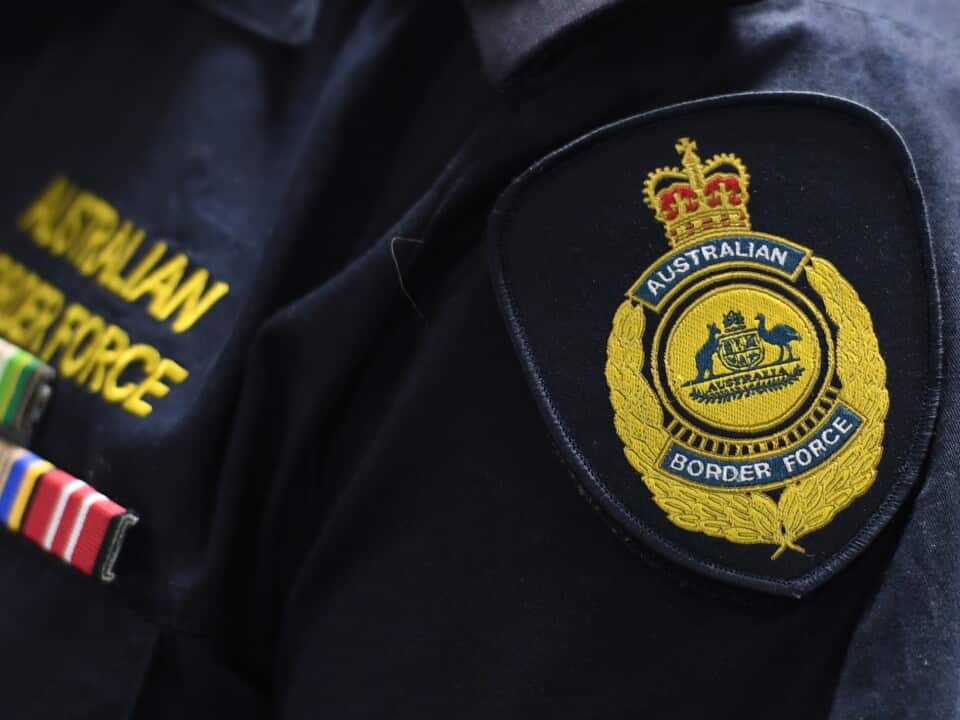 An Australian Border Force emblem is seen on a uniform