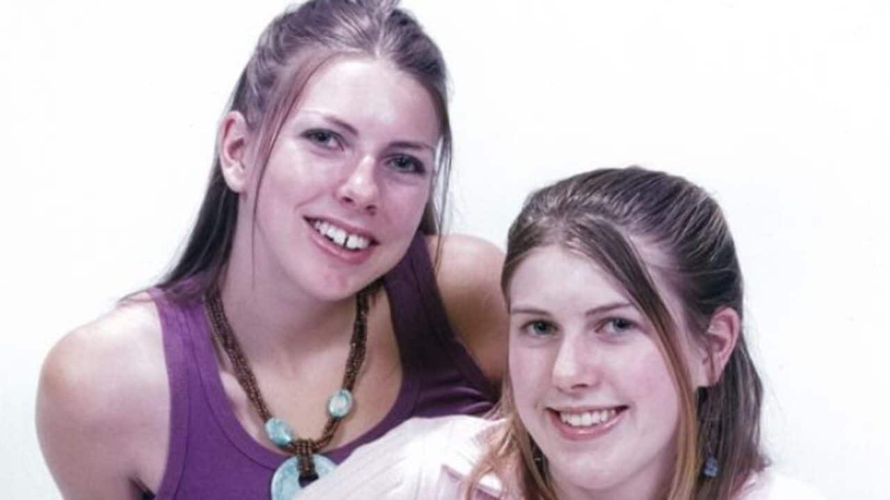 Anna and Katie smiling as teenagers