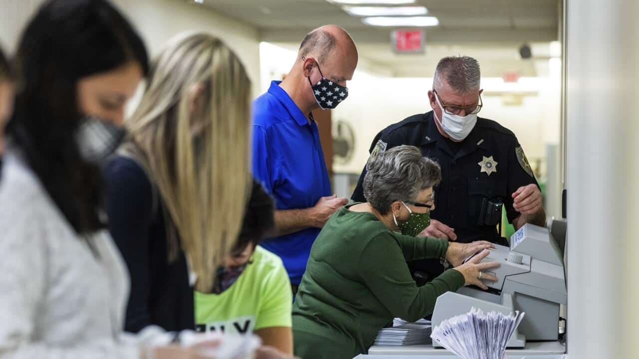 Election workers prepare ballots for counting in the basement of the Beaver County Courthouse on Wednesday, 4 November, 2020, in Beaver, Pennsylvania.