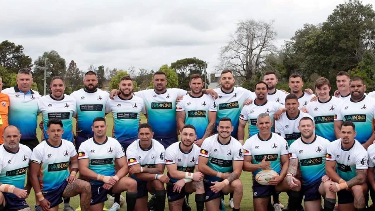Black Cockatoos pose for a team photo