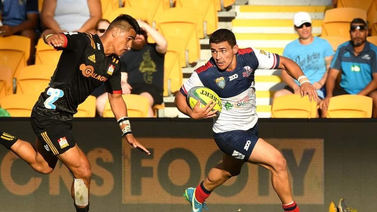 Queensland Reds player Izaia Perese crosses over for a try.