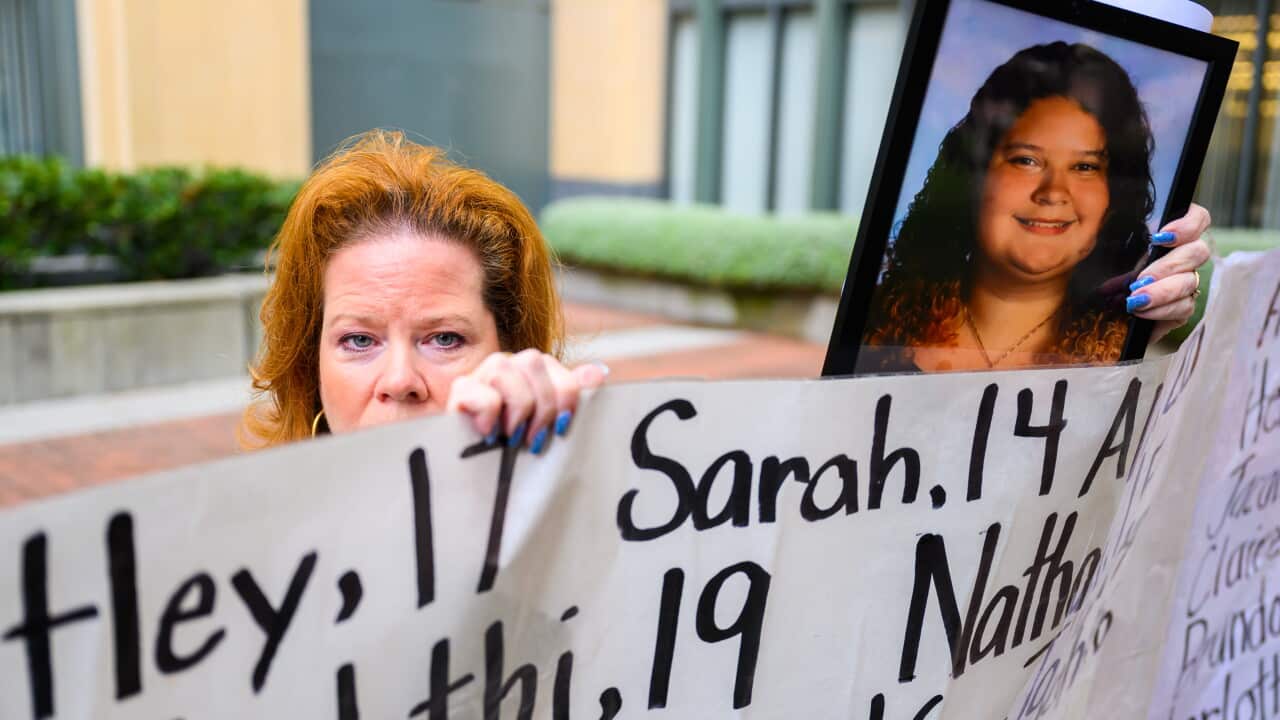 Erin Popolo holds up a photograph of her late daughter Emmy Murillo during a press conference memorializing children lost due to social media harm outside the Ronald V Dellums Courthouse on Tuesday, August 18, 2026 in Oakland, Calif.