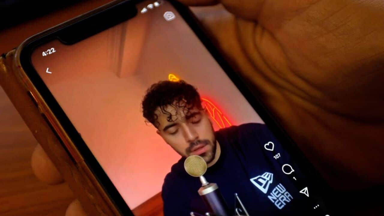 A picture of a man on a mobile phone