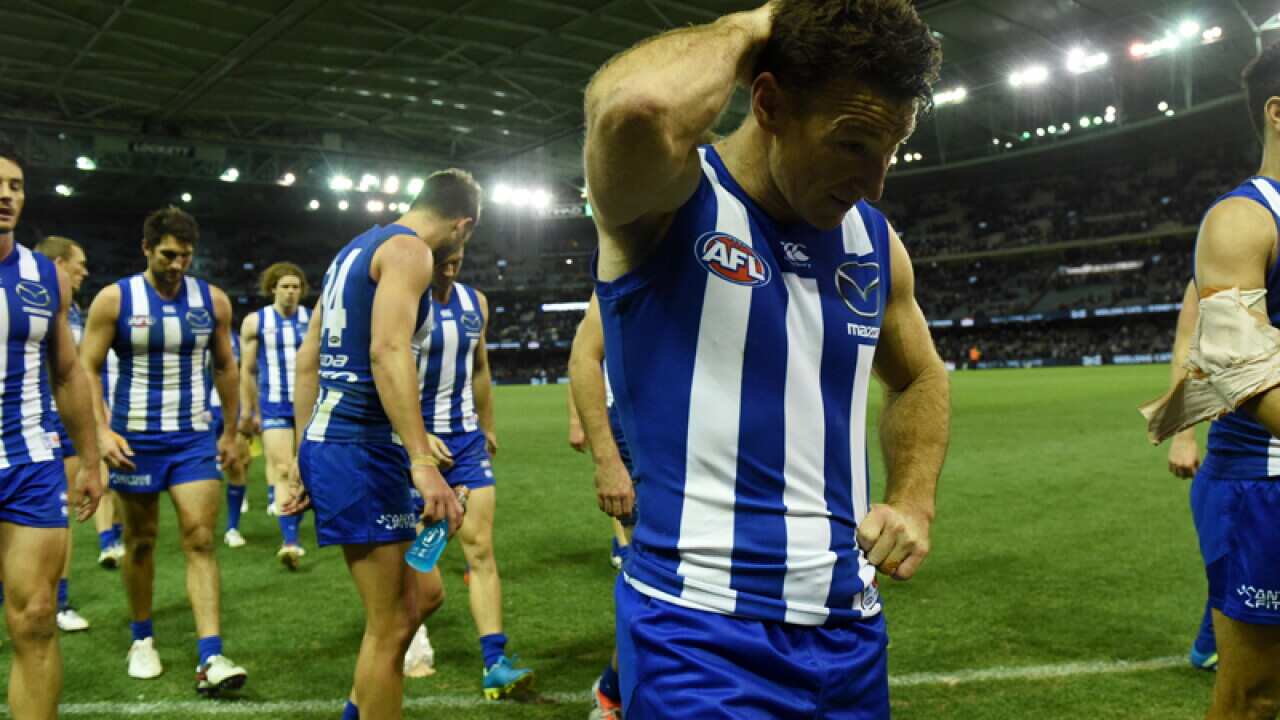 The Kangaroos walk off the field
