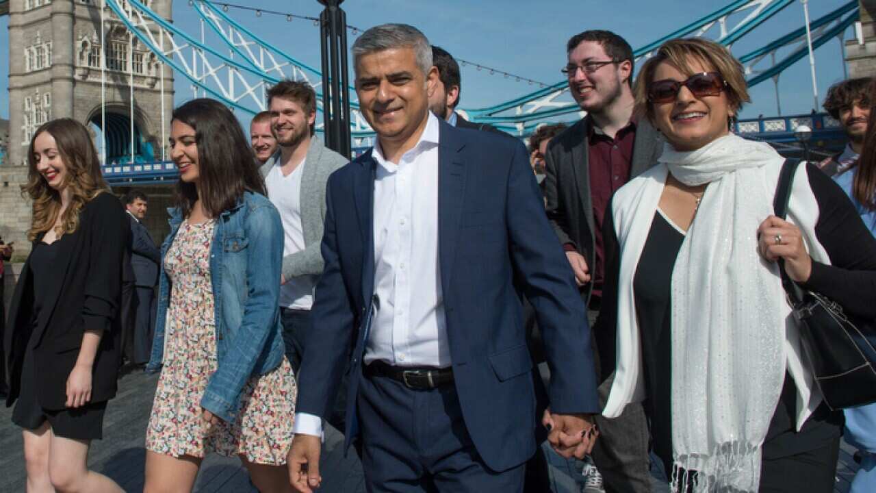 Labour mayoral candidate Sadiq Khan arrives at City Hall in London with his wife Saadiya