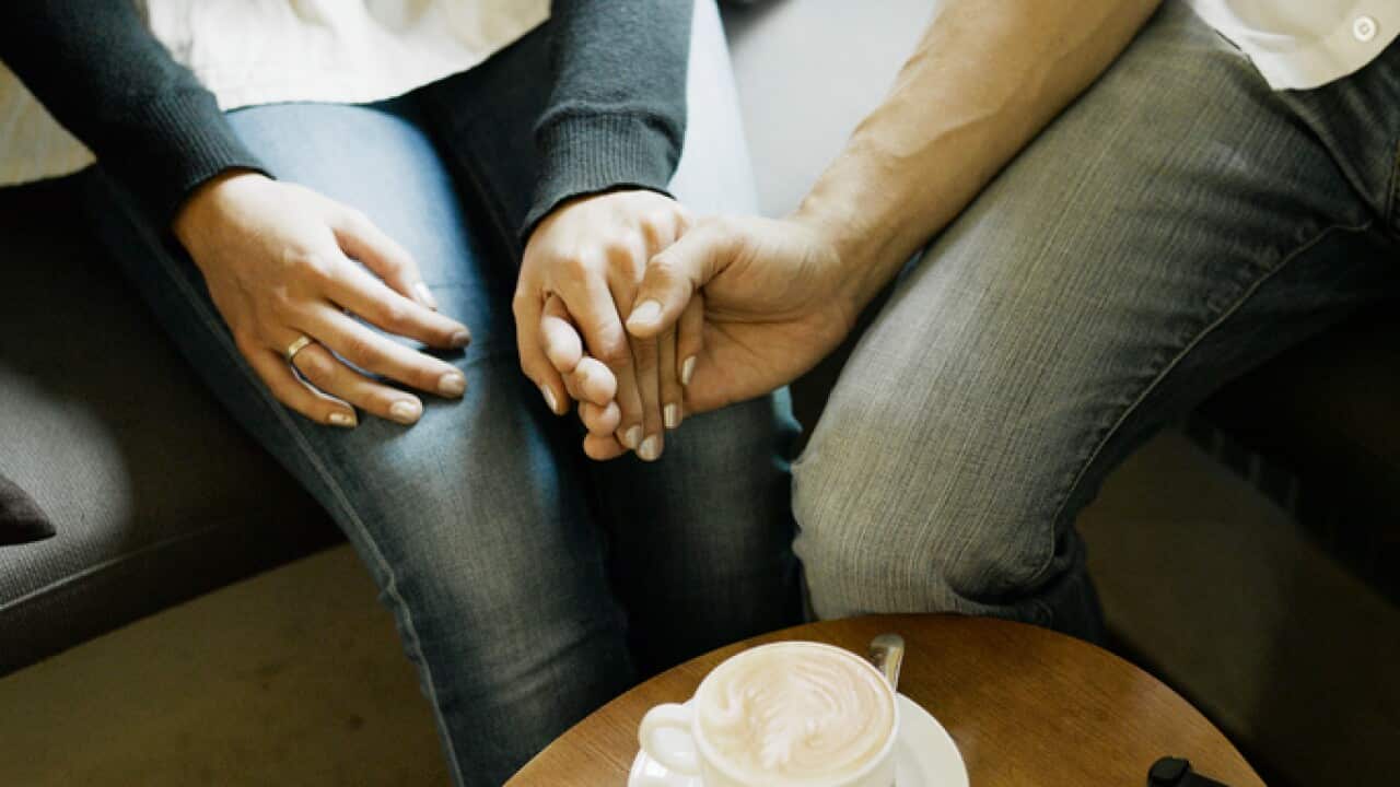 Couple holding hands