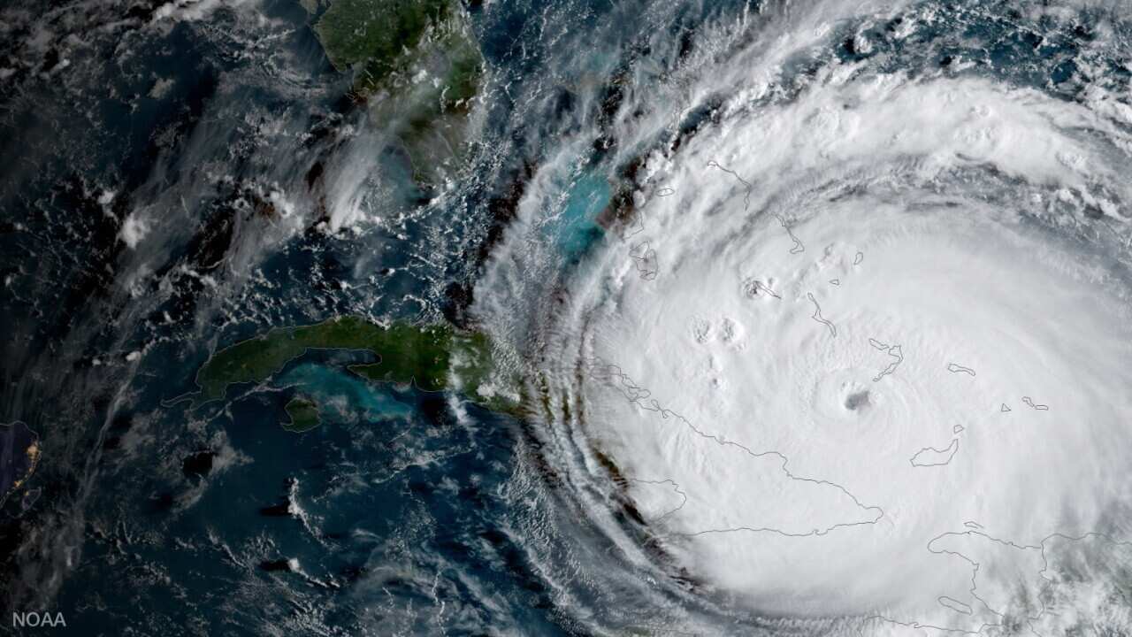 In this NOAA handout image, NOAA's GOES satellite shows Hurricane Irma passing the eastern end of Cuba