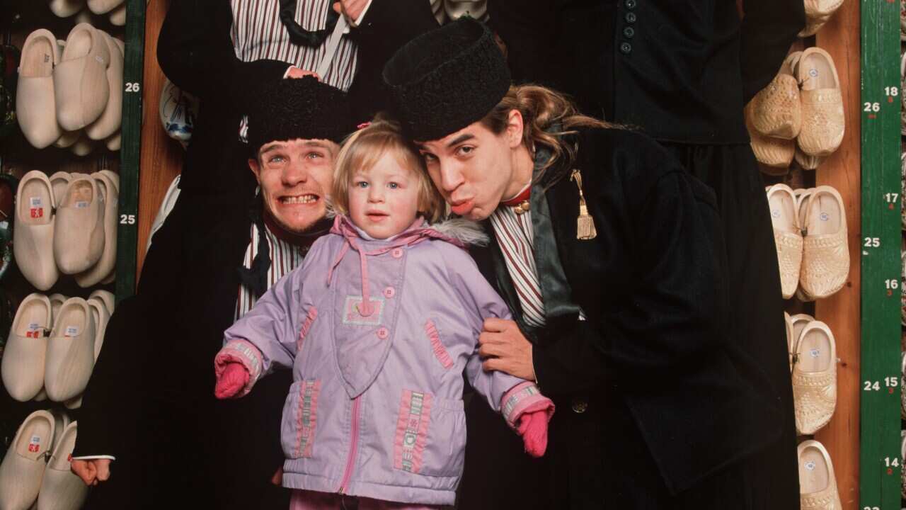Dutch photographer William Rutten took this photo of the Red Hot Chili Peppers in 1990, but who is this little girl?