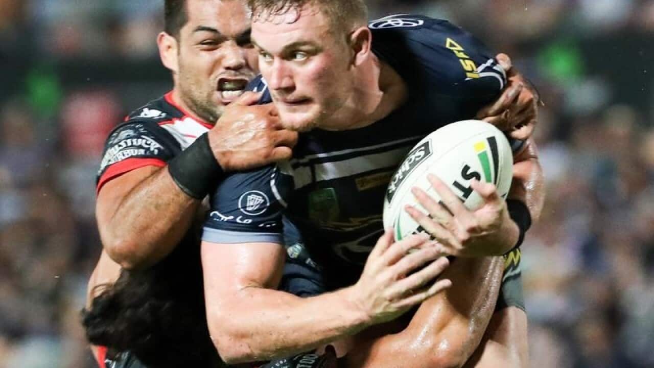 A file image of Coen Hess of the Cowboys being tackled.