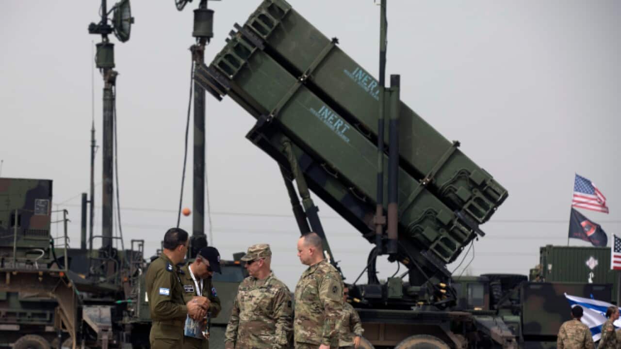 US Air Force and Israeli Air force personnel next to a Patriot missile defense system at the Israeli Air Force Base of Hatzor, Israel