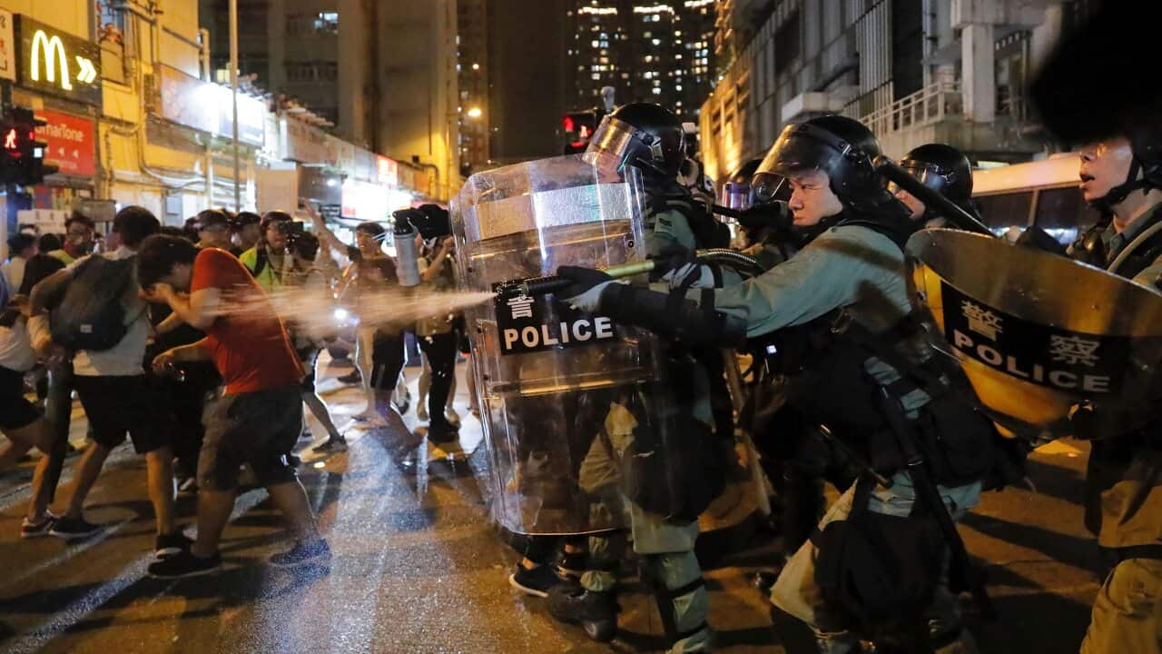 Riot police fire pepper spray against protesters during the anti-extradition bill protest in Hong Kong on Sunday.