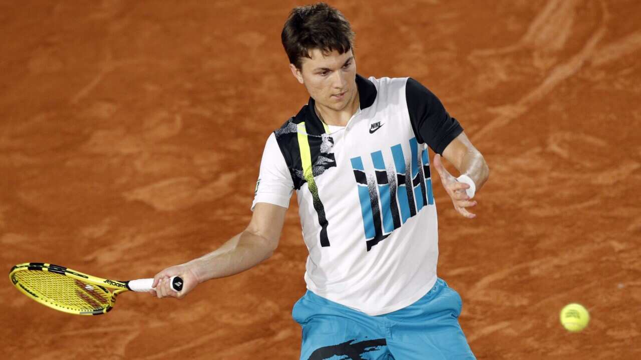 Miomir Kecmanovic of Serbia in action against Diego Schwartzman of Argentina during their men’s first round match during the French Open tennis tournament at Roland Garros in Paris, France, 27 September 2020.